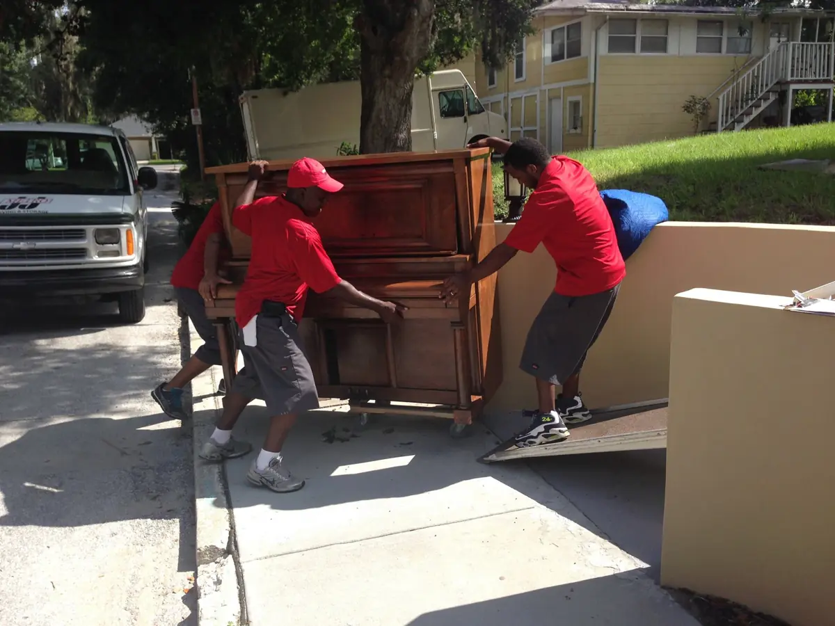 J&J Metro crew handling furniture during a move
