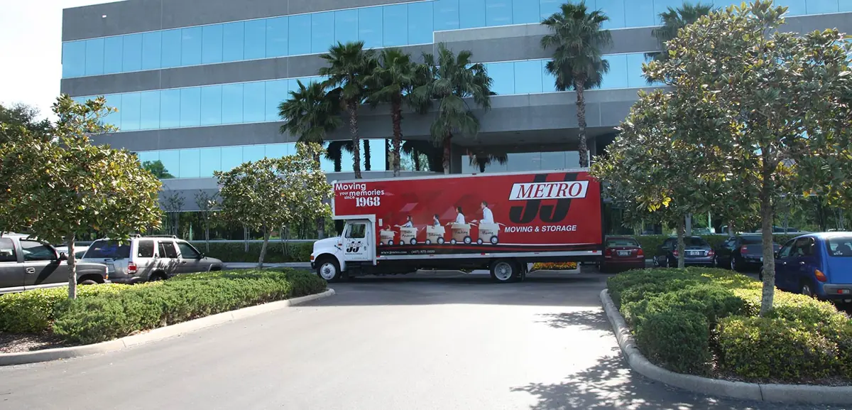 J&J Metro Moving and Storage truck at a commercial property