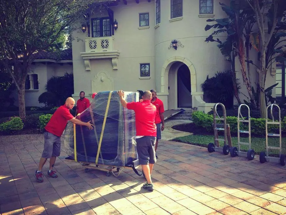 J&J Metro crew handling a protected piano